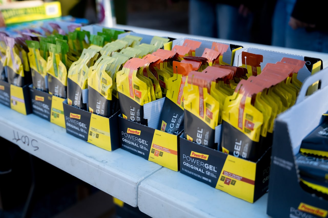 powerbar gels sitting on table at cycling event