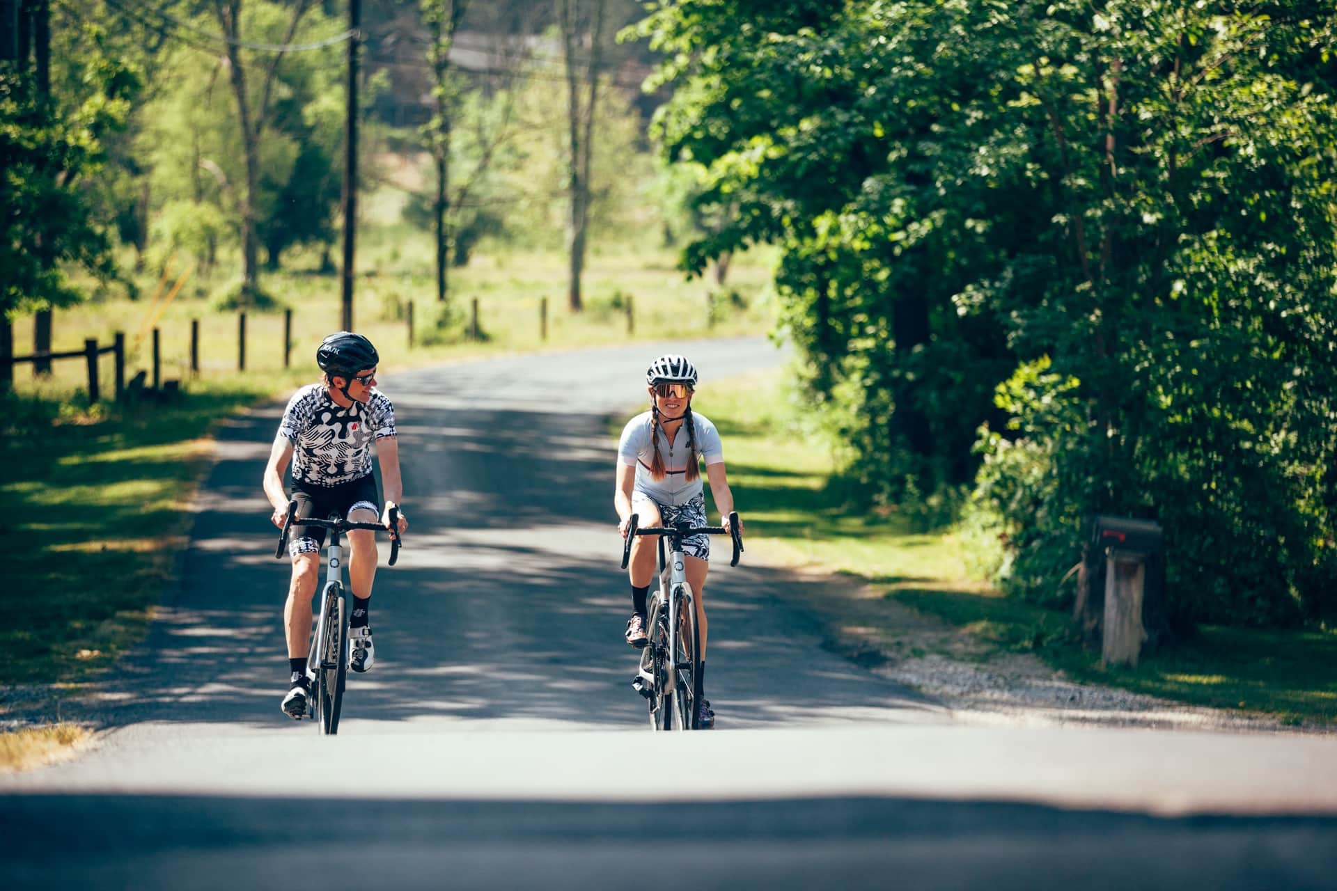 two riders talking while cycling