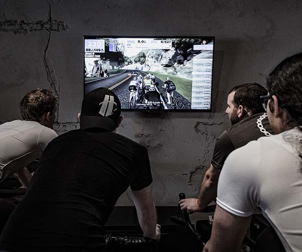 cyclists on indoor trainer