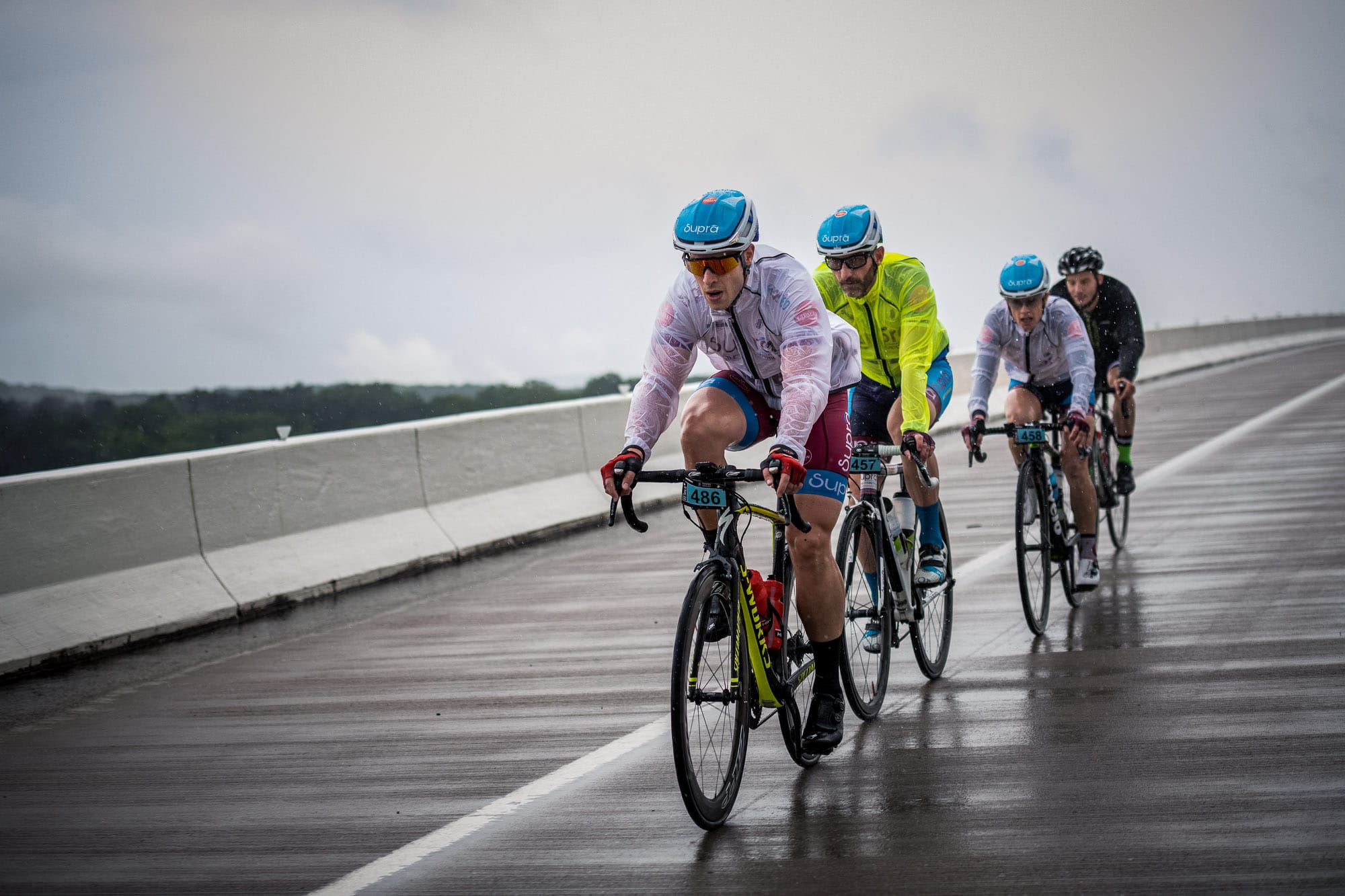 cyclists riding in the rain